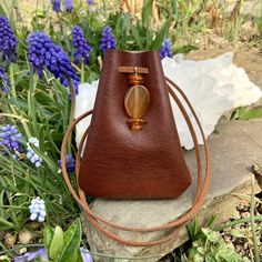 "Vegan Eco Leather Medicine Bag, Shaman Bag or Amulet Pouch to wear around your neck-or hang in your Car! A place for things that have Spiritual Meaning for you-your Sage,Crystals,or that pretty rock your 3 year old gave you.... 3 3/4\"deep 2 3/4\"wide Choice of 2 colors:- - -Black /Double Terminated Labradorite Crystal Point -Russet Brown/Red Agate and Baltic Amber Stones Please note these are natural Gemstones- each one is completely different...like snowflakes! BUY ANY 4 MEDICINE BAGS(VEGAN L Brown Coin Purse For Gifts, Brown Portable Pouch For Gift, Brown Portable Coin Purse For Gift, Portable Brown Coin Purse For Gift, Small Brown Bag For Gift, Small Brown Gift Bag, Sage Crystals, Necklace Pouch, Leather Medicine Bag