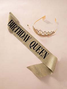 a birthday queen sash and tiara on a pink background