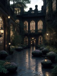 an outdoor courtyard with potted plants and lights on the walkway at night in front of large arched windows