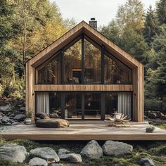 a wooden house surrounded by rocks and trees