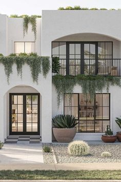 an artist's rendering of a house with plants on the front