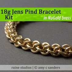 a close up of a gold bracelet on a gray surface with the words 16g lens pin braclet in nu odd brass