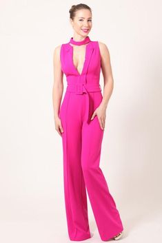 You will be a world class beauty in this Fuchsia jumpsuit with its elongated V-neck, fitted/belted waistline, and flowy pants! Style this eye-catching piece with a nice clutch bag and high heels for a modern and elegant holiday look! Fashion jumpsuit with belt and button detail 95% Polyester/5% Spandex AVAILABLE IN FUCHSIA Jumpsuit With Belt, Pink Jumpsuit, Flowy Pants, Pants Style, Holiday Looks, Jumpsuit Fashion, World Class, Dress Code, Button Detail