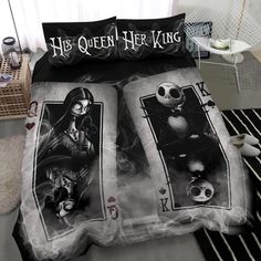 a bed with two sheets that have pictures of jack skellingy and the skeleton king on them