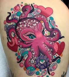 an octopus tattoo on the back of a woman's thigh with hearts and bubbles