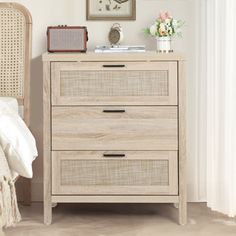 a bedroom scene with focus on the chest of drawers and an open window in the background