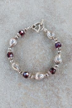 "Sterling Silver and Swarovski Crystal Handmade Bracelet 7.5 \". All beads, bead caps, and toggle clasp are sterling silver. Swarovski crystals are 8mm Burgandy. Large sterling beads are Hill Tribe Silver. Really pretty bracelet! Any of my handmade jewelry can be adjusted in size, just message me under the listing. Check out my other jewelry at https://loveofjewelryshop.etsy.com" Antique Silver Jewelry, Jewelry Making Earrings, Swarovski Crystal Bracelet, Hill Tribe Silver, Handmade Beaded Jewelry, Pretty Bracelets, Crystal Bracelet, Sterling Silver Bracelet, Toggle Clasp