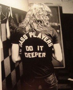 black and white photograph of a woman wearing a t - shirt that says bass players do it deeper