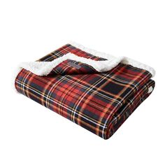 a red and black plaid blanket with white fur trim