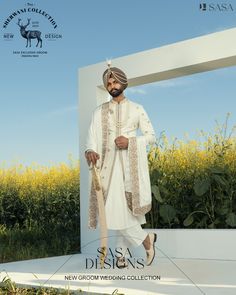 a man in a white outfit is standing outside