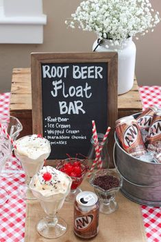 root beer floatr bar with ice cream, cherry and whipped cream in buckets