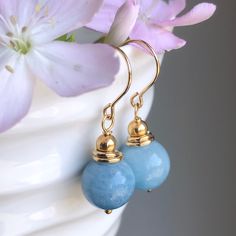 "6686 Aquamarine Earrings Gold Filled natural blue gemstone classic modern dangle drops simple everyday March birthstone birthday anniversary Valentine's day Mother's day Christmas holiday gift for her women mom sister wife girlfriend daughter niece aunt grandma cousin colleague best friend. Enjoy the beauty & power of natural gemstone. MATERIALS & DIMENSIONS ✦ Natural AQUAMARINE, sky blue, smooth round beads 10mm; ✦ GOLD FILLED beads, spacers, pins and fish hook (shown) or lever back ear wires; Elegant Birthstone Earrings For Birthday, Classic Blue Earrings For Everyday, Elegant Sapphire Jewelry For Birthday, Blue Dangle Jewelry For Birthday, Elegant Jewelry With Natural Stones For Birthdays, Elegant Natural Stone Jewelry For Birthdays, Elegant Natural Stone Jewelry For Birthday, Fish Hooks Show, Garnet Necklace Gold