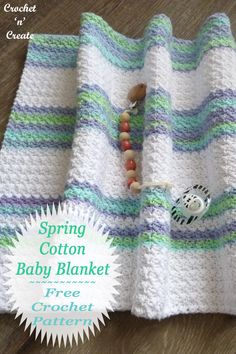 a crocheted baby blanket with beads on it and the text spring cotton baby blanket free crochet pattern