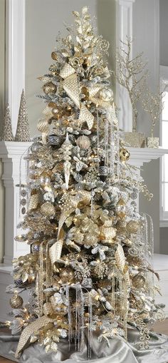 a christmas tree with gold and silver decorations