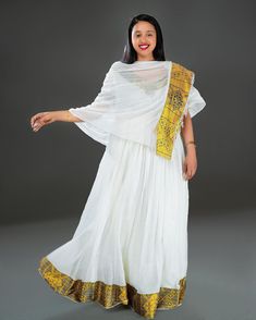 Indulge in the opulence of Ethiopian tradition with our exquisite Habesha dress, adorned in a resplendent golden-yellow hue and adorned with beautiful patterns that tell a story of heritage and elegance. Ethiopian Dresses, Ethiopian Fashion, Eritrean Dress, Ethiopian Clothing, Habesha Dress, Ethiopian Dress, Habesha Kemis, Dress Traditional, Modern Dress