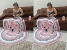 a woman sitting on top of a couch next to a pink and gray dog blanket