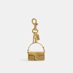 Calling all bag lovers. This polished charm captures our customer-favorite Tabby bag in rich detail. Attach it to a favorite bag or set of keys. | Coach Tabby Bag Charm - Women's - Brass/brass Rectangular Logo Bag Charm, Logo Charm Bag For Everyday Use, Elegant Rectangular Bag With Keychain, Small Elegant Travel Bag, Luxury Small Travel Bags, Luxury Bag Charm With Keychain, Travel Bags With Key Clip, Gold Travel Bag With Metal Hardware, Gold Travel Bags With Metal Hardware