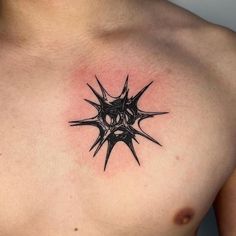 a man's chest with a tattoo design on the top and bottom part of his chest