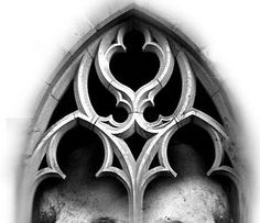 a black and white photo of a skull in a gothic window