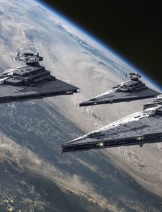 three star wars ships flying in formation over the earth