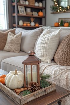 a living room filled with lots of furniture and decor on top of a coffee table