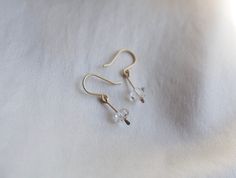 These dainty earrings are a cute way to add a little subtle sparkle to your look! Elegant and understated crystal earrings, but with a raw feel to them. The clean design of these earrings makes them really classy and versatile. Each earring contains a teeny floating Herkimer diamond. Herkimer diamonds are mined from a specific mine from New York State and are known by the double termination (pointy on both sides of the crystal) They are held in a little drop of brass, hammered for a rough textur Minimalist Sterling Silver Crystal Earrings, Dainty Hypoallergenic Crystal Earrings For Everyday, Minimalist Dangle Crystal Earrings, Minimalist Crystal Drop Earrings, Minimalist Dangle Crystal Earrings With Ear Wire, Minimalist Crystal Drop Earrings With Ear Wire, Minimalist Sterling Silver Crystal Earrings For Everyday, Everyday Minimalist Sterling Silver Crystal Earrings, Minimalist Nickel-free Dangle Crystal Earrings