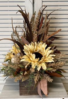 a vase filled with lots of different types of flowers