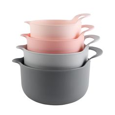 three bowls stacked on top of each other in different colors and sizes, one with a pink lid