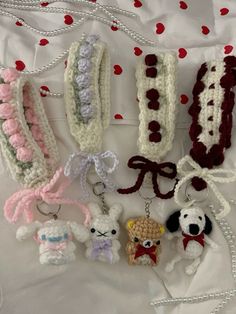 several crocheted keychains are arranged on a sheet