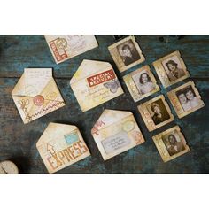 some old fashioned envelopes are laying on a table with other antique items around them