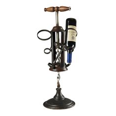 a wine bottle holder with two bottles on it and a pair of scissors hanging from the top