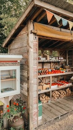 a small wooden building with lots of produce on display