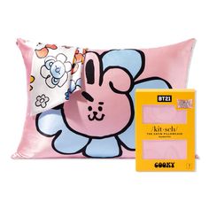 a pink pillow with a cartoon character on it and a yellow box next to it