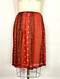 How amazing is this red floral vintage 90s skirt by Uniform John Paul Richard? The outer layer of this high waisted skirt is made of floral chiffon, and the inner layer is a comfy beige slip that falls knee length with a thin elastic waist band. This skirt is a Y2K statement piece with a cottagecore look. This vintage floral skirt is perfect for spring or summer. Thanks for visiting, we are adding new items t our shop like this everyday! Back length: 25 inches Hip: 40 inches Waist: 24 inches Cottagecore Skirt, Skirt Cottagecore, 90s Skirt, Red Floral Skirt, Vintage Floral Skirt, John Paul, Shorts With Tights, Floral Chiffon, Floral Vintage