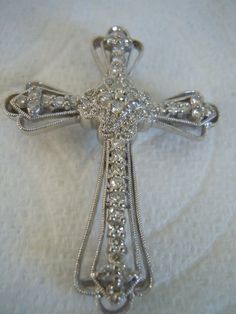 Vintage Stunning 18k Multi Diamonds Cross Pendant Religious Necklace Brooch Pin. Beautiful rich sparkle to stones in 18k White Gold. So brilliant, yet soft sparkle. Large Statement Beauty. The cross is marked 750. Total diamond weight is .84 cts. The clarity of the diamonds if G-I and the clarity if SI2-I1. The cross appraises at $2,175.00 Free Ship In the USA. Email for Quote to ship out of USA. Thank you for viewing. Vintage Bakelite, Diamond Cross Pendants, Diamond Cross, Blue Rhinestones, Cool Items, The Cross, Cross Pendant, Beautiful Earrings, Brooch Pin