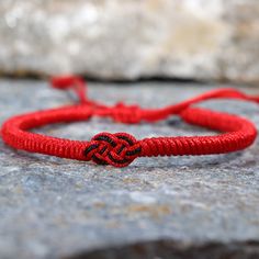 The Tibetan braided Lucky Knot Bracelet is a beautifully crafted accessory Handmade with love and care using the ancient art of Tibetan knot techniques. ✅ KNOTS : Each knot is meticulously tied, resulting in a stunning pattern that symbolizes the interconnectedness of life. The intricate knots create a mesmerizing visual spectacle, capturing the attention of anyone who beholds it. ✅ ADJUSTABLE: Its size is adjustable between 16 -24 cm, and fits standard Unisex sizes, if you need a smaller size i Handmade Symbolic Braided Bracelets As Gift, Traditional Braided Bracelets As Gifts, Traditional Braided Bracelets For Gifts, Traditional Braided Friendship Bracelets As Gifts, Red Braided Jewelry As A Gift, Red Braided Jewelry For Gifts, Red Braided Jewelry Perfect As A Gift, Red Macrame Braided Bracelet As Gift, Red Macrame Braided Bracelet For Gift