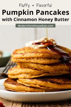 pumpkin pancakes with cinnamon honey butter on a white plate and text overlay reads fluffy & flavorful pumpkin pancakes with cinnamon honey butter