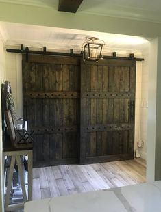 two large wooden doors in a room