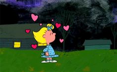 a cartoon girl with hearts flying in the air and looking at her heart shaped nose