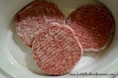 three hamburger patties in a white bowl