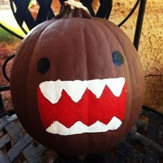 a pumpkin decorated to look like a monster's teeth