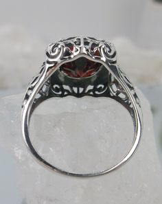 "Red Garnet Ring (Choose Garnet CZ or a Natural Red Garnet Gemstone) Beauty Design#229 MADE TO ORDER Ring Description This is a brand new stunning Art Nouveau/Victorian reproduction sterling silver filigree ring. The flawless oval-cut high-quality 5ct Red Garnet gemstone is 12mm by 10mm (just shy of 3/8\" inch) in dimension. (Choose between a Red Garnet CZ or a Natural 5ct Natural Garnet (VVS)). The ring is 5/8th of an inch (16.5mm) NS (long) on the finger. The ring and gem sit 7mm off the finge Sterling Silver Garnet Ring, Red Garnet Ring, Garnet Gem, Gemstone Art, Gothic Design, Gems Art, Luxury Rings, Beauty Design, Red Band