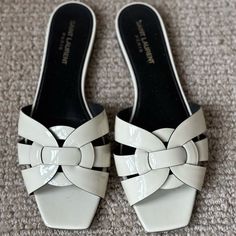 Hard To Find, Ivory Patent Leather, Authentic Ysl Slides. In Euc - Only The Bottom Soles Show Any Sign Of Wear. Look Amazing On! Comes W Original Box And Dust Bags. Designer White Patent Leather Sandals, Chic Cream Patent Leather Sandals, Ysl Slides, Ysl Tribute, Yves Saint Laurent Shoes, Leather Slide Sandals, Leather Slides, Off White Color, Slide Sandals