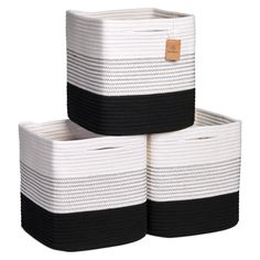 three black and white baskets stacked on top of each other