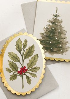 two christmas cards with holly leaves on them and a pine tree in the middle one