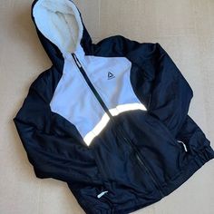 Brand New - Never Worn - Tag Not Included Reebok Reflective Jacket Faux Fur Lining In The Jacket And Hood Faux Fur Are Not In The Sleeves Very Warm Adjustable Hoodie Loose Fit Good Condition Luxury Urban Nylon Hooded Jacket, Luxury Nylon Puffer Jacket With Zip Fly, Fur Puffer Jacket, Reflective Jacket, Womens Reebok, Faux Fur Jacket, Puffer Jacket, Faux Fur, Puffer