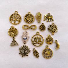 Set of 16 antique gold Yoga themed  / hamsa hands / tribal charms are perfect for jewelry making or crafting.  These charms would also make a great gift for a yoga instructor or yoga enthusiast.   Antique gold charms included as shown in pictures. Yoga Instructor, Gold Charms, Hamsa Hand, Etsy Crafts, Gold Charm, Diy Jewelry Making, Mind Body, Antique Gold, Diy Jewelry