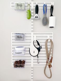 there are many items on the pegs to hold them in this wall mounted organizer