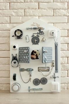 a white wall mounted with various items on it