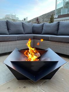 a fire pit sitting on top of a patio